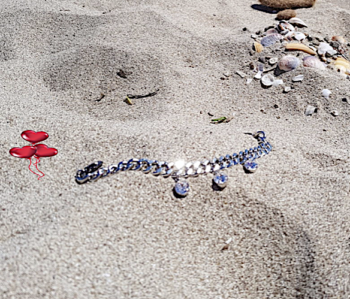 Stambi pasidabruota grandinėlė - apyrankė su Swarovski kristalais